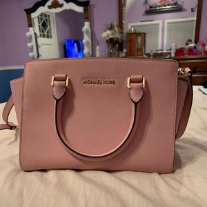 Pink Michael Kors purse with strap